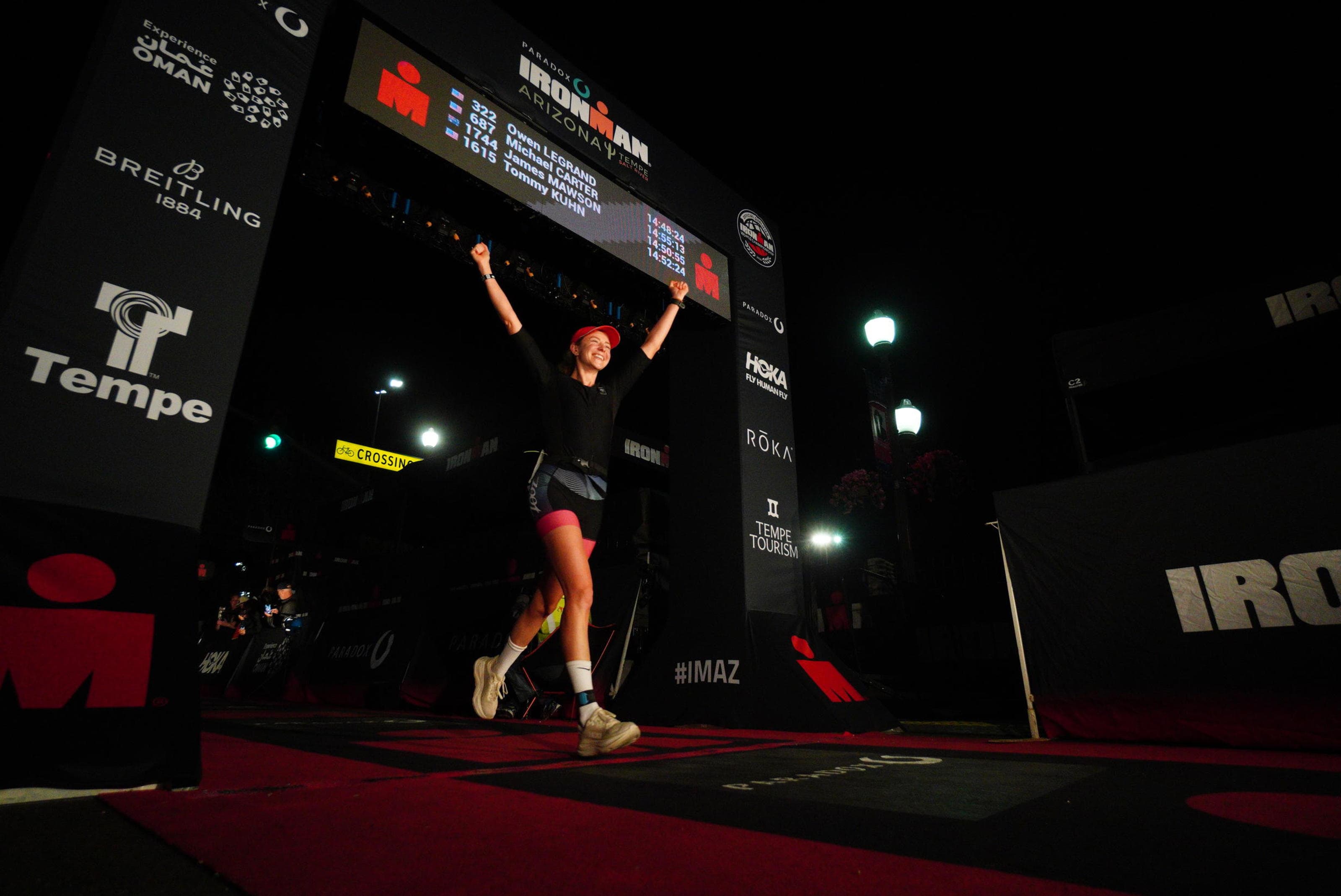 Endurance athlete crossing a race finish line